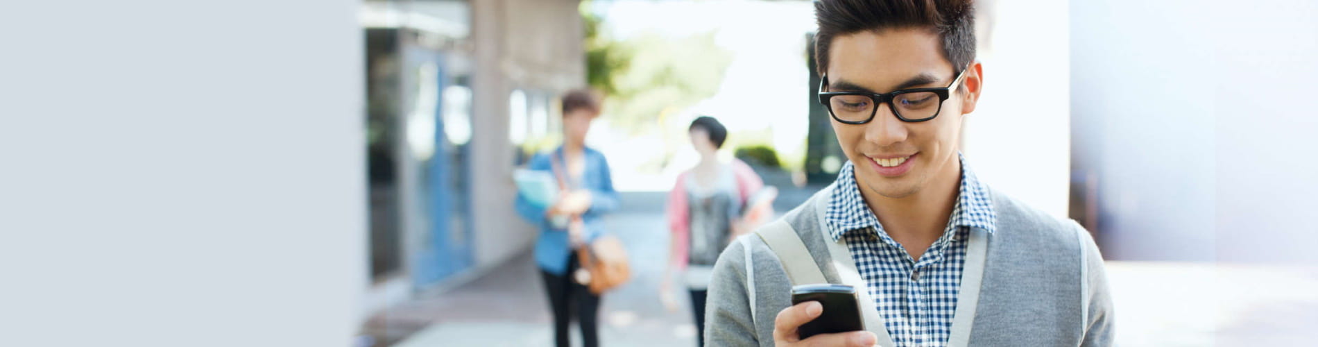 Young asian Student using QIAsphere on his phone